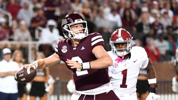 Mississippi State Bulldogs quarterback Will Rogers (2) throws from his own end zone as Alabama defensive back Kool-Aid McKinstry (1) pressures him on a corner blitz in Davis Wade Stadium at Mississippi State University.